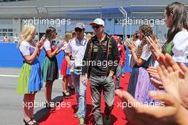 (L to R): Adrian Sutil (GER) Sauber with Nico Hulkenberg (GER) Sahara Force India F1 on the drivers parade. 22.06.2014. Formula 1 World Championship, Rd 8, Austrian Grand Prix, Spielberg, Austria, Race Day.