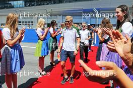 Marcus Ericsson (SWE) Caterham on the drivers parade. 22.06.2014. Formula 1 World Championship, Rd 8, Austrian Grand Prix, Spielberg, Austria, Race Day.