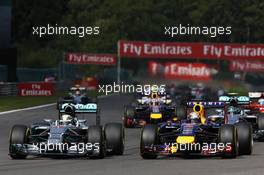 (L to R): Lewis Hamilton (GBR) Mercedes AMG F1 W05 and Sebastian Vettel (GER) Red Bull Racing RB10 battle for position at the start of the race. 24.08.2014. Formula 1 World Championship, Rd 12, Belgian Grand Prix, Spa Francorchamps, Belgium, Race Day.