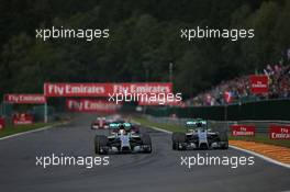 (L to R): Lewis Hamilton (GBR) Mercedes AMG F1 W05 and Nico Rosberg (GER) Mercedes AMG F1 W05 battle for position leading to contact. 24.08.2014. Formula 1 World Championship, Rd 12, Belgian Grand Prix, Spa Francorchamps, Belgium, Race Day.
