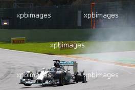 Lewis Hamilton (GBR) Mercedes AMG F1 W05 heads to the pits with a puncture after contact with team mate Nico Rosberg (GER) Mercedes AMG F1. 24.08.2014. Formula 1 World Championship, Rd 12, Belgian Grand Prix, Spa Francorchamps, Belgium, Race Day.