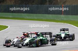 Andre Lotterer (GER) Caterham CT05 and Romain Grosjean (FRA) Lotus F1 E22 battle for position. 24.08.2014. Formula 1 World Championship, Rd 12, Belgian Grand Prix, Spa Francorchamps, Belgium, Race Day.