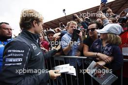 Nico Rosberg (GER) Mercedes AMG F1 signs autographs for the fans. 21.08.2014. Formula 1 World Championship, Rd 12, Belgian Grand Prix, Spa Francorchamps, Belgium, Preparation Day.