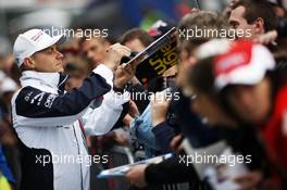 Valtteri Bottas (FIN) Williams signs autographs for the fans. 21.08.2014. Formula 1 World Championship, Rd 12, Belgian Grand Prix, Spa Francorchamps, Belgium, Preparation Day.