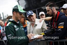 Andre Lotterer (GER) Caterham F1 Team signs autographs for the fans. 21.08.2014. Formula 1 World Championship, Rd 12, Belgian Grand Prix, Spa Francorchamps, Belgium, Preparation Day.