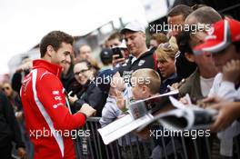 Jules Bianchi (FRA) Marussia F1 Team signs autographs for the fans. 21.08.2014. Formula 1 World Championship, Rd 12, Belgian Grand Prix, Spa Francorchamps, Belgium, Preparation Day.