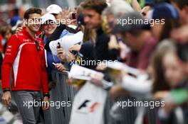 Jules Bianchi (FRA) Marussia F1 Team signs autographs for the fans. 21.08.2014. Formula 1 World Championship, Rd 12, Belgian Grand Prix, Spa Francorchamps, Belgium, Preparation Day.