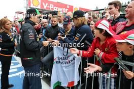 Sergio Perez (MEX) Sahara Force India F1 signs autographs for the fans. 21.08.2014. Formula 1 World Championship, Rd 12, Belgian Grand Prix, Spa Francorchamps, Belgium, Preparation Day.