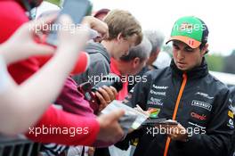 Sergio Perez (MEX) Sahara Force India F1 signs autographs for the fans. 21.08.2014. Formula 1 World Championship, Rd 12, Belgian Grand Prix, Spa Francorchamps, Belgium, Preparation Day.