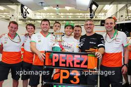 Sergio Perez (MEX) Sahara Force India F1 celebrates his third position the team. 06.04.2014. Formula 1 World Championship, Rd 3, Bahrain Grand Prix, Sakhir, Bahrain, Race Day.