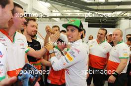 Sergio Perez (MEX) Sahara Force India F1 celebrates his third position with the team. 06.04.2014. Formula 1 World Championship, Rd 3, Bahrain Grand Prix, Sakhir, Bahrain, Race Day.