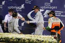 The podium: Lewis Hamilton (GBR) Mercedes AMG F1 and Nico Rosberg (GER) Mercedes AMG F1 celebrate with Aldo Costa (ITA) Mercedes AMG F1 Engineering Director ans Sergio Perez (MEX) Sahara Force India F1 on the podium. 06.04.2014. Formula 1 World Championship, Rd 3, Bahrain Grand Prix, Sakhir, Bahrain, Race Day.