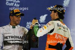 The podium (L to R): Race winner Lewis Hamilton (GBR) Mercedes AMG F1 celebrates with third placed Sergio Perez (MEX) Sahara Force India F1. 06.04.2014. Formula 1 World Championship, Rd 3, Bahrain Grand Prix, Sakhir, Bahrain, Race Day.