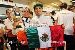 Sergio Perez (MEX) Sahara Force India F1 celebrates his third position the team. 06.04.2014. Formula 1 World Championship, Rd 3, Bahrain Grand Prix, Sakhir, Bahrain, Race Day.