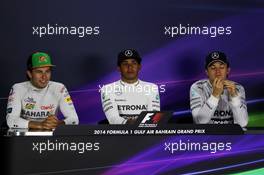 The post race FIA Press Conference (L to R): Sergio Perez (MEX) Sahara Force India F1, third; Lewis Hamilton (GBR) Mercedes AMG F1, race winner; Nico Rosberg (GER) Mercedes AMG F1, second. 06.04.2014. Formula 1 World Championship, Rd 3, Bahrain Grand Prix, Sakhir, Bahrain, Race Day.