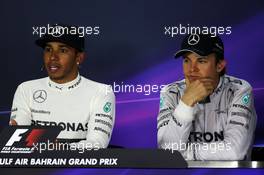 Race winner Lewis Hamilton (GBR) Mercedes AMG F1 with team mate Nico Rosberg (GER) Mercedes AMG F1 in the post race FIA Press Conference. 06.04.2014. Formula 1 World Championship, Rd 3, Bahrain Grand Prix, Sakhir, Bahrain, Race Day.