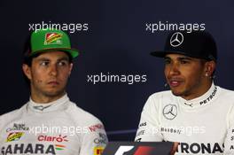 Race winner Lewis Hamilton (GBR) Mercedes AMG F1 with Sergio Perez (MEX) Sahara Force India F1 in the post race FIA Press Conference. 06.04.2014. Formula 1 World Championship, Rd 3, Bahrain Grand Prix, Sakhir, Bahrain, Race Day.