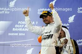 Race winner Lewis Hamilton (GBR) Mercedes AMG F1 celebrates on the podium. 06.04.2014. Formula 1 World Championship, Rd 3, Bahrain Grand Prix, Sakhir, Bahrain, Race Day.
