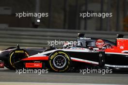 Adrian Sutil (GER) Sauber C33 and Jules Bianchi (FRA) Marussia F1 Team MR03 battle for position. 06.04.2014. Formula 1 World Championship, Rd 3, Bahrain Grand Prix, Sakhir, Bahrain, Race Day.