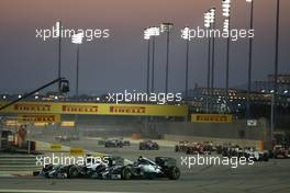 Lewis Hamilton (GBR) Mercedes AMG F1 W05 and Nico Rosberg (GER) Mercedes AMG F1 W05 at the start of the race. 06.04.2014. Formula 1 World Championship, Rd 3, Bahrain Grand Prix, Sakhir, Bahrain, Race Day.