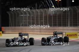 (L to R): Lewis Hamilton (GBR) Mercedes AMG F1 W05 and team mate Nico Rosberg (GER) Mercedes AMG F1 W05 battle for position. 06.04.2014. Formula 1 World Championship, Rd 3, Bahrain Grand Prix, Sakhir, Bahrain, Race Day.