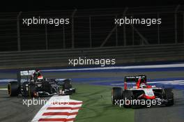 Jules Bianchi (FRA) Marussia F1 Team MR03 runs wide ahead of Adrian Sutil (GER) Sauber C33. 06.04.2014. Formula 1 World Championship, Rd 3, Bahrain Grand Prix, Sakhir, Bahrain, Race Day.
