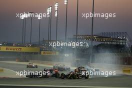 Daniil Kvyat (RUS) Scuderia Toro Rosso STR9 and Pastor Maldonado (VEN) Lotus F1 E21 at the start of the race. 06.04.2014. Formula 1 World Championship, Rd 3, Bahrain Grand Prix, Sakhir, Bahrain, Race Day.