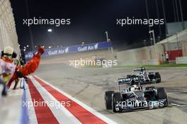 Race winner Lewis Hamilton (GBR) Mercedes AMG F1 W05 celebrates at the end of the race ahead of second placed team mate Nico Rosberg (GER) Mercedes AMG F1 W05. 06.04.2014. Formula 1 World Championship, Rd 3, Bahrain Grand Prix, Sakhir, Bahrain, Race Day.