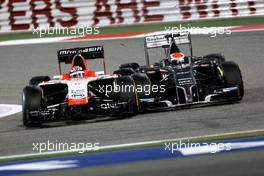 Jules Bianchi (FRA), Marussia F1 Team  and Adrian Sutil (GER), Sauber F1 Team  06.04.2014. Formula 1 World Championship, Rd 3, Bahrain Grand Prix, Sakhir, Bahrain, Race Day.