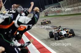 Third placed Sergio Perez (MEX) Sahara Force India F1 VJM07 celebrates as he passes his team. 06.04.2014. Formula 1 World Championship, Rd 3, Bahrain Grand Prix, Sakhir, Bahrain, Race Day.