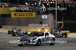 Lewis Hamilton (GBR) Mercedes AMG F1 W05 leads behind the FIA Safety Car. 06.04.2014. Formula 1 World Championship, Rd 3, Bahrain Grand Prix, Sakhir, Bahrain, Race Day.