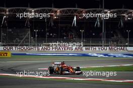 Kimi Raikkonen (FIN) Ferrari F14-T passes the Michael Schumacher corner where a message of support is displayed on the armco. 05.04.2014. Formula 1 World Championship, Rd 3, Bahrain Grand Prix, Sakhir, Bahrain, Qualifying Day.