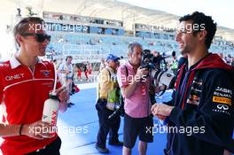 (L to R): Max Chilton (GBR) Marussia F1 Team with Daniel Ricciardo (AUS) Red Bull Racing. 06.04.2014. Formula 1 World Championship, Rd 3, Bahrain Grand Prix, Sakhir, Bahrain, Race Day.