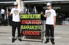 Jenson Button (GBR) McLaren celebrates his 250th GP with his team mate Kevin Magnussen (DEN) McLaren. 06.04.2014. Formula 1 World Championship, Rd 3, Bahrain Grand Prix, Sakhir, Bahrain, Race Day.