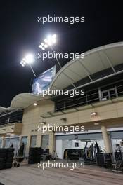 The pits under floodlights at night. 03.04.2014. Formula 1 World Championship, Rd 3, Bahrain Grand Prix, Sakhir, Bahrain, Preparation Day.