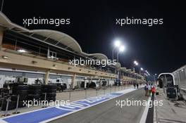 The pits under floodlights at night. 03.04.2014. Formula 1 World Championship, Rd 3, Bahrain Grand Prix, Sakhir, Bahrain, Preparation Day.