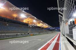 The pit straight under floodlights at night. 03.04.2014. Formula 1 World Championship, Rd 3, Bahrain Grand Prix, Sakhir, Bahrain, Preparation Day.