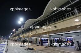 The Red Bull Racing pits under floodlights at night. 03.04.2014. Formula 1 World Championship, Rd 3, Bahrain Grand Prix, Sakhir, Bahrain, Preparation Day.
