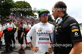 (L to R): Sergio Perez (MEX) Sahara Force India F1 with Gianpiero Lambiase (ITA) Sahara Force India F1 Engineer on the grid. 09.11.2014. Formula 1 World Championship, Rd 18, Brazilian Grand Prix, Sao Paulo, Brazil, Race Day.