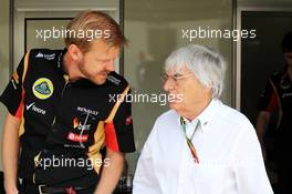 (L to R): Andy Stobart (GBR) Lotus F1 Team Press Officer with Bernie Ecclestone (GBR). 09.11.2014. Formula 1 World Championship, Rd 18, Brazilian Grand Prix, Sao Paulo, Brazil, Race Day.