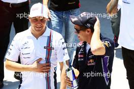 (L to R): Valtteri Bottas (FIN) Williams with Sebastian Vettel (GER) Red Bull Racing on the drivers parade. 09.11.2014. Formula 1 World Championship, Rd 18, Brazilian Grand Prix, Sao Paulo, Brazil, Race Day.