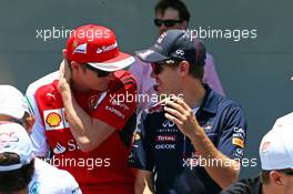 (L to R): Kimi Raikkonen (FIN) Ferrari with Sebastian Vettel (GER) Red Bull Racing on the drivers parade. 09.11.2014. Formula 1 World Championship, Rd 18, Brazilian Grand Prix, Sao Paulo, Brazil, Race Day.