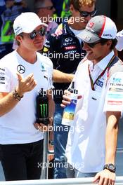 (L to R): Nico Rosberg (GER) Mercedes AMG F1 with Adrian Sutil (GER) Sauber on the drivers parade. 09.11.2014. Formula 1 World Championship, Rd 18, Brazilian Grand Prix, Sao Paulo, Brazil, Race Day.
