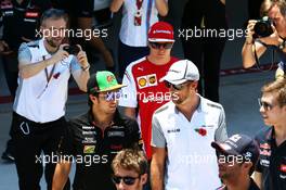 (L to R): Sergio Perez (MEX) Sahara Force India F1 with Jenson Button (GBR) McLaren on the drivers parade. 09.11.2014. Formula 1 World Championship, Rd 18, Brazilian Grand Prix, Sao Paulo, Brazil, Race Day.