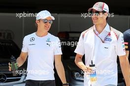 (L to R): Nico Rosberg (GER) Mercedes AMG F1 W05 with Adrian Sutil (GER) Sauber on the drivers parade. 09.11.2014. Formula 1 World Championship, Rd 18, Brazilian Grand Prix, Sao Paulo, Brazil, Race Day.