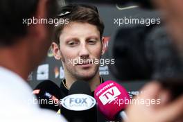 Romain Grosjean (FRA) Lotus F1 Team with the media. 06.11.2014. Formula 1 World Championship, Rd 18, Brazilian Grand Prix, Sao Paulo, Brazil, Preparation Day.