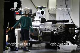 A boy photographs the Williams FW36 of Valtteri Bottas (FIN) Williams FW36 in the pits. 18.04.2014. Formula 1 World Championship, Rd 4, Chinese Grand Prix, Shanghai, China, Practice Day.