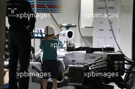 A boy photographs the Williams FW36 of Valtteri Bottas (FIN) Williams FW36 in the pits. 18.04.2014. Formula 1 World Championship, Rd 4, Chinese Grand Prix, Shanghai, China, Practice Day.