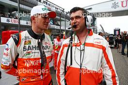 Nico Hulkenberg (GER) Sahara Force India F1 on the grid with Bradley Joyce (GBR) Sahara Force India F1 Race Engineer. 20.04.2014. Formula 1 World Championship, Rd 4, Chinese Grand Prix, Shanghai, China, Race Day.