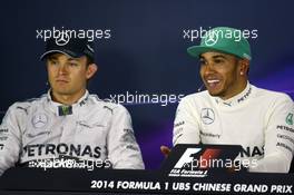 (L to R): Nico Rosberg (GER) Mercedes AMG F1 with team mate Lewis Hamilton (GBR) Mercedes AMG F1 in the FIA Press Conference. 20.04.2014. Formula 1 World Championship, Rd 4, Chinese Grand Prix, Shanghai, China, Race Day.